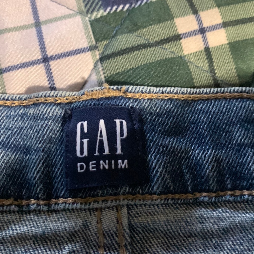 Women Gap distressed button fly shorts